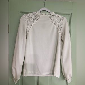 Medium, White blouse w/ lacey details on the shoulders